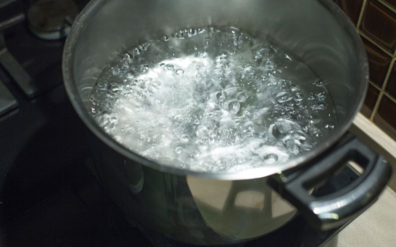 How do you boil water quietly?